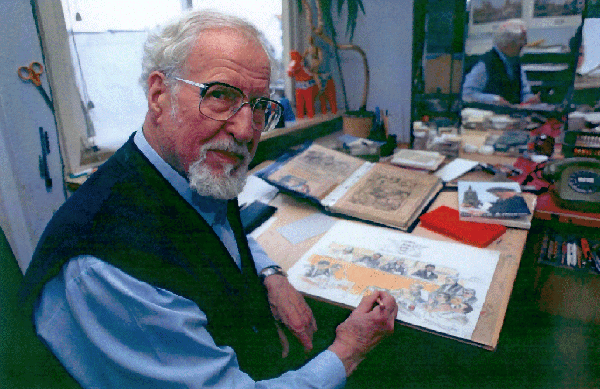 Erich Dittmann (Künstlername "edi") am Schreibtisch in seinem Atelier